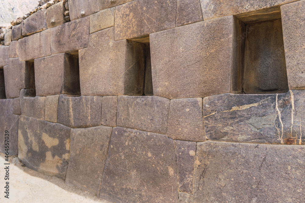 inca ruins in the sacred valley carved in granite windows bumps and stone walls located in ollantaytambo cusco peru on a sunny day with blue sky inca ruins in the sacred valley carved in granite windows bumps and stone walls located in ollantaytambo cusco peru on a sunny day with blue sky