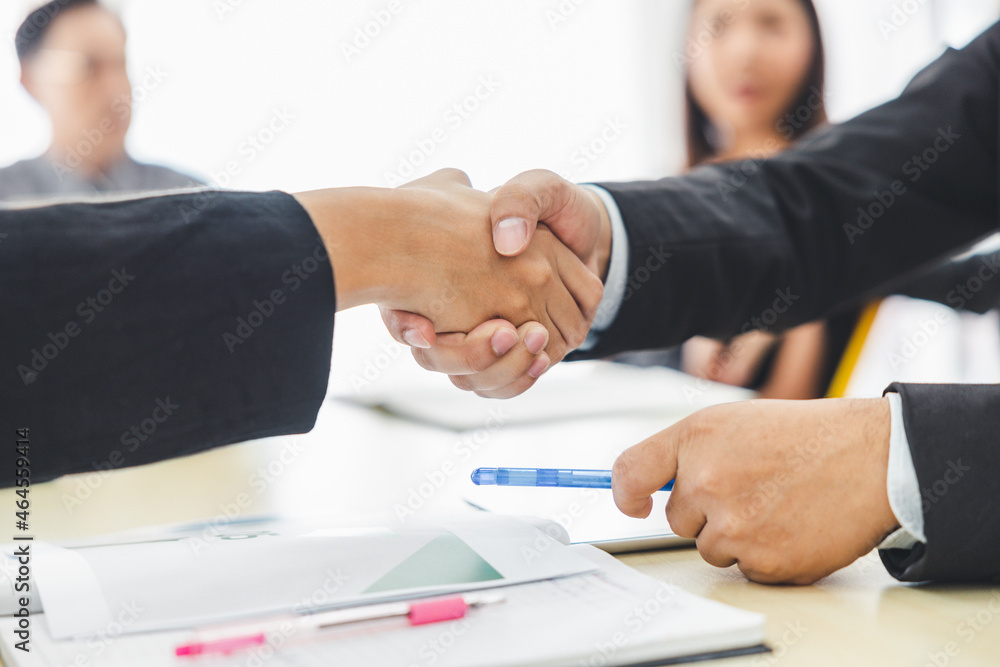 Close-up of business people who agree to cooperate in business to make the event successful. Close-up of business people who agree to cooperate in business to make the event successful.