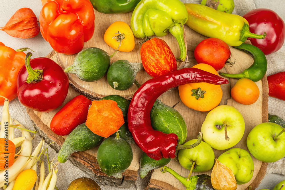 Trendy ugly organic vegetables and fruits on stone concrete background Trendy ugly organic vegetables and fruits on stone concrete background