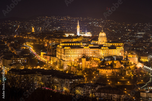 Historic Royal Palace - Buda Castle or Budai Vár close up evening view with lights on from Buda Hills, Citadella in Budapest, Hungary © Tamas