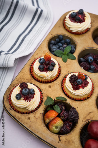 cupcake with berries on a mold with a cloth