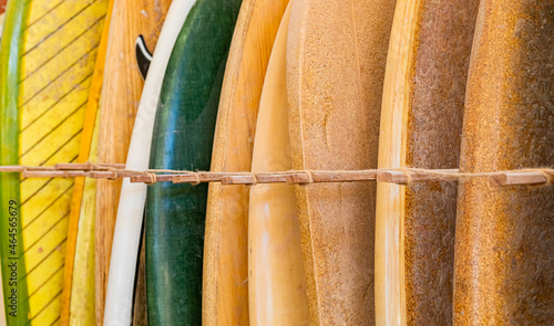 Photography retro vintage surfboards lined up in a local surf shop