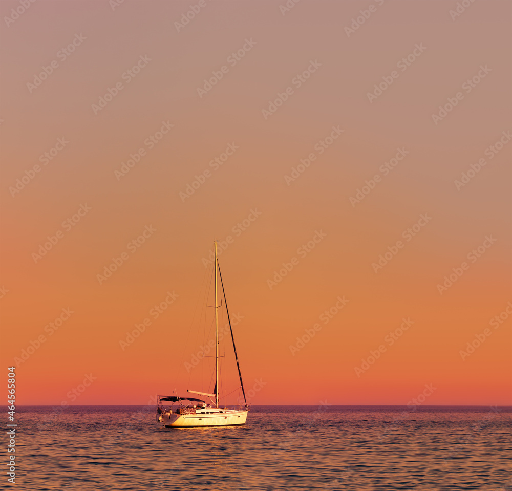 Yacht in a calm sea, a beautiful sunset, the calm. Waves.Beautiful photo.