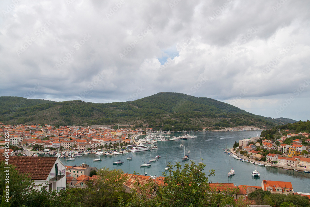 High angle panorama of Mediterranean town and harbor on stormy day