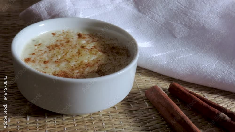 Cinnamon rice pudding in a white bowl. Typical dessert. Cinnamon rice pudding in a white bowl. Typical dessert.