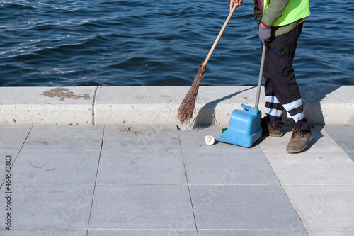 Streetcleaner, scavenger, garbageman, dustman, sweeper stock photo.