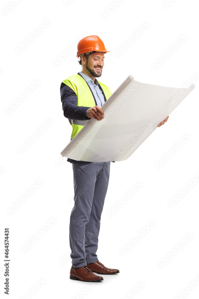 Full length shot of a site engineer looking at a blueprint Full length shot of a site engineer looking at a blueprint
