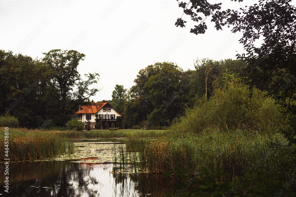 House with orange roof by the lake House with orange roof by the lake