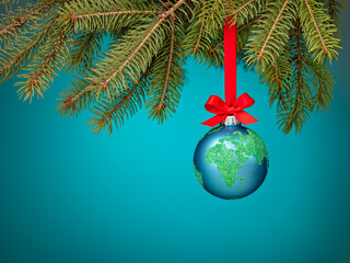 Globe christmas ball ornament hanging on a blue background