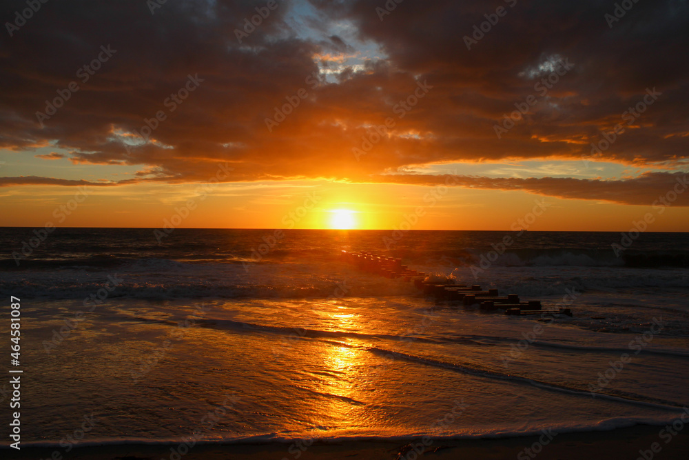 Sunrise reflecting on the beach 