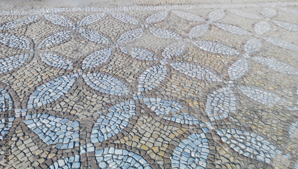 Ancient mosaic covering the ground laid out with pieces of stones in a neat pattern Ancient mosaic covering the ground laid out with pieces of stones in a neat pattern