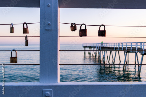 Love locks by the ocean photo