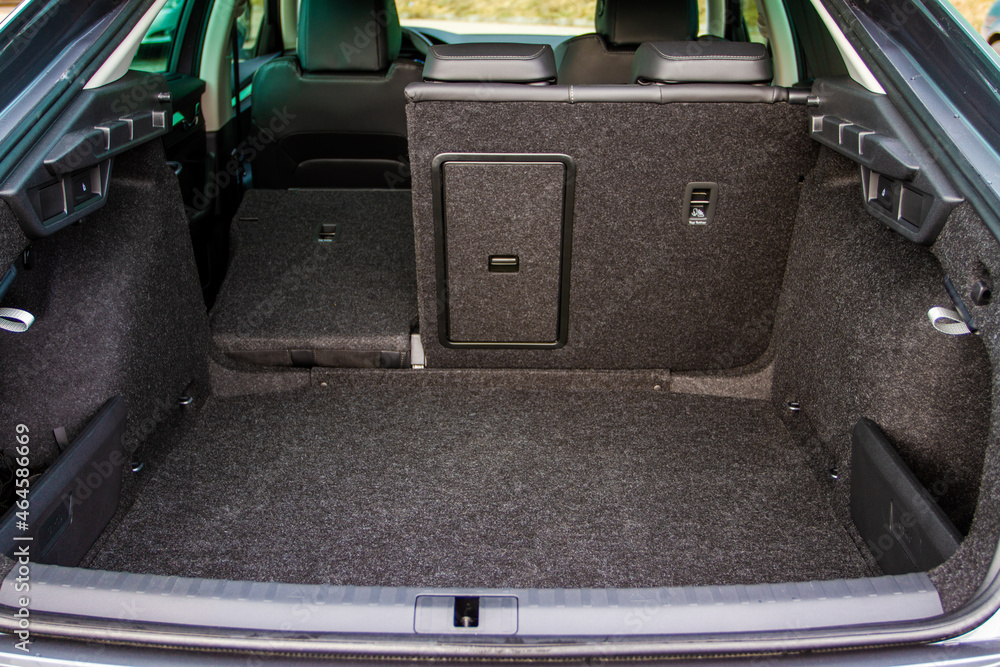 Modern sedan car open trunk. Huge, clean and empty car trunk in interior of modern car. Modern sedan car open trunk. Huge, clean and empty car trunk in interior of modern car.