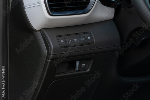Close up view of modern car electronic safety systems control panel. Modern car interior detail.