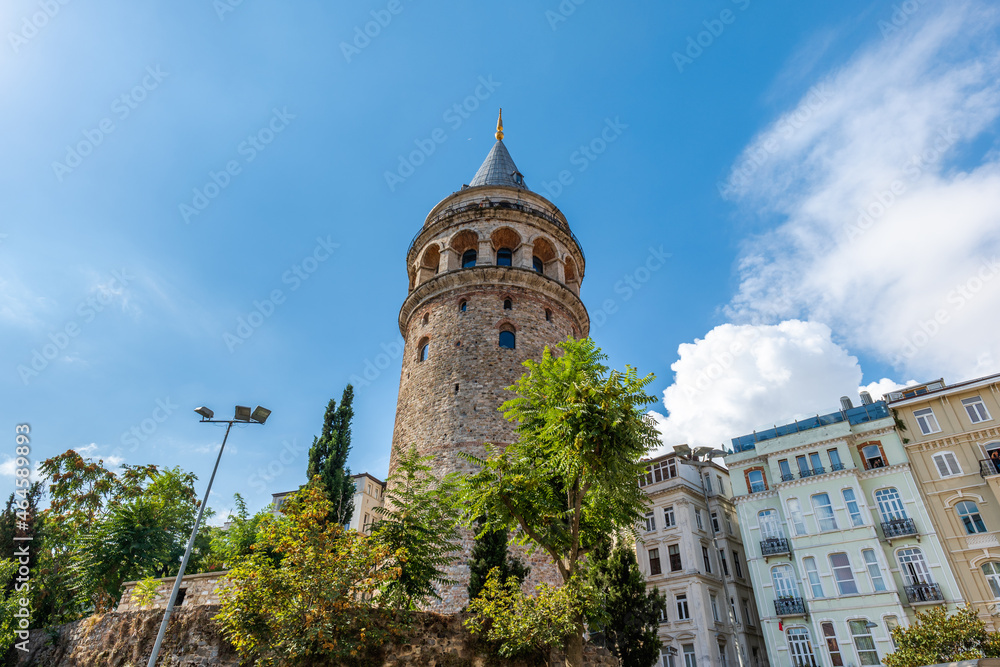 Galata Tower in Istanbul in summer, symbolic landmark in Galata area of Istanbul, Turkey. The historical building is famous for tourists