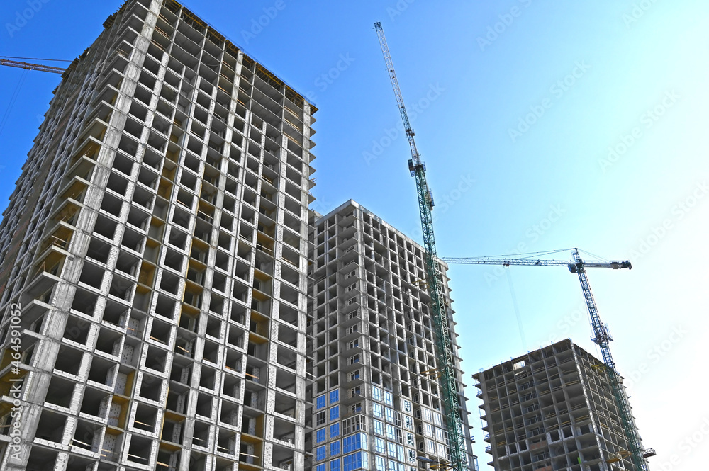 Fototapeta premium Crane and highrise construction site