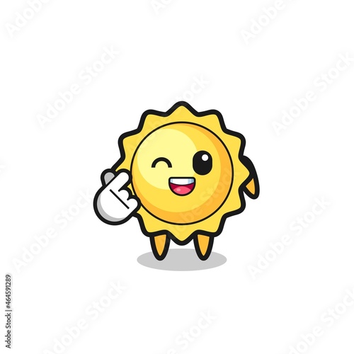 sun character doing Korean finger heart