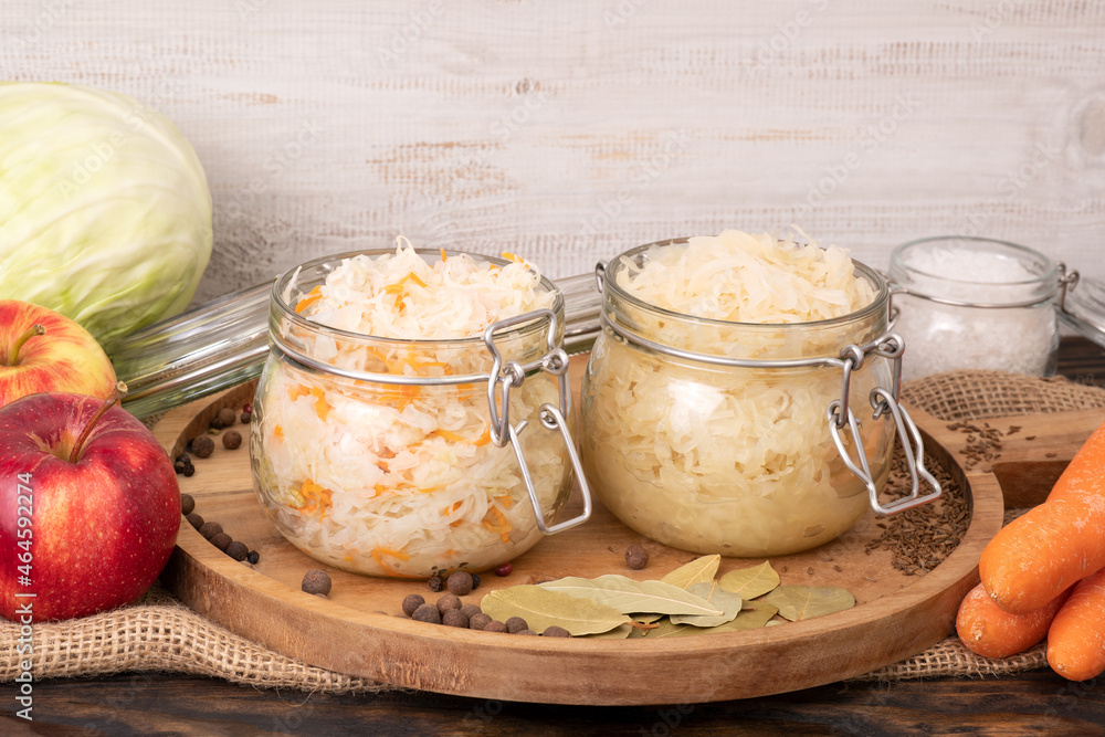 Sauerkraut, fermented cabbage in jars, healthy probiotic food - obrazy, fototapety, plakaty 
