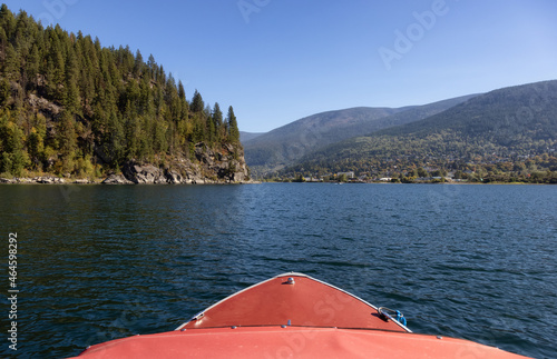 Boat riding on Kootenay River. Sunny Fall Season Morning. Located in Nelson, British Columbia, Canada.