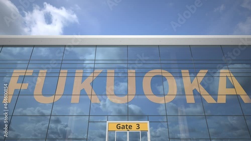 FUKUOKA city name and landing plane at modern airport