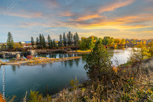 Sunset and a colorful sky above the Spokane River at Islands Trail Head park along the Centennial Trail in Spokane, Washington, USA, with fall colors at Autumn.