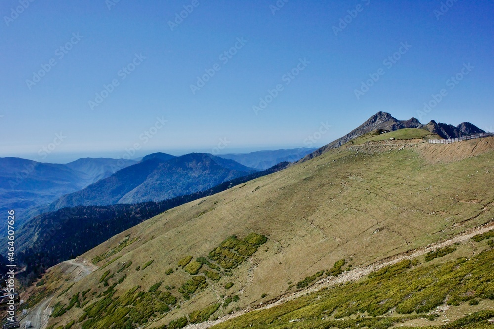 Fototapeta premium Beautiful landscapes of mountain ranges of the Caucasus Mountains in the Krasnaya Polyana region of Sochi, Russia