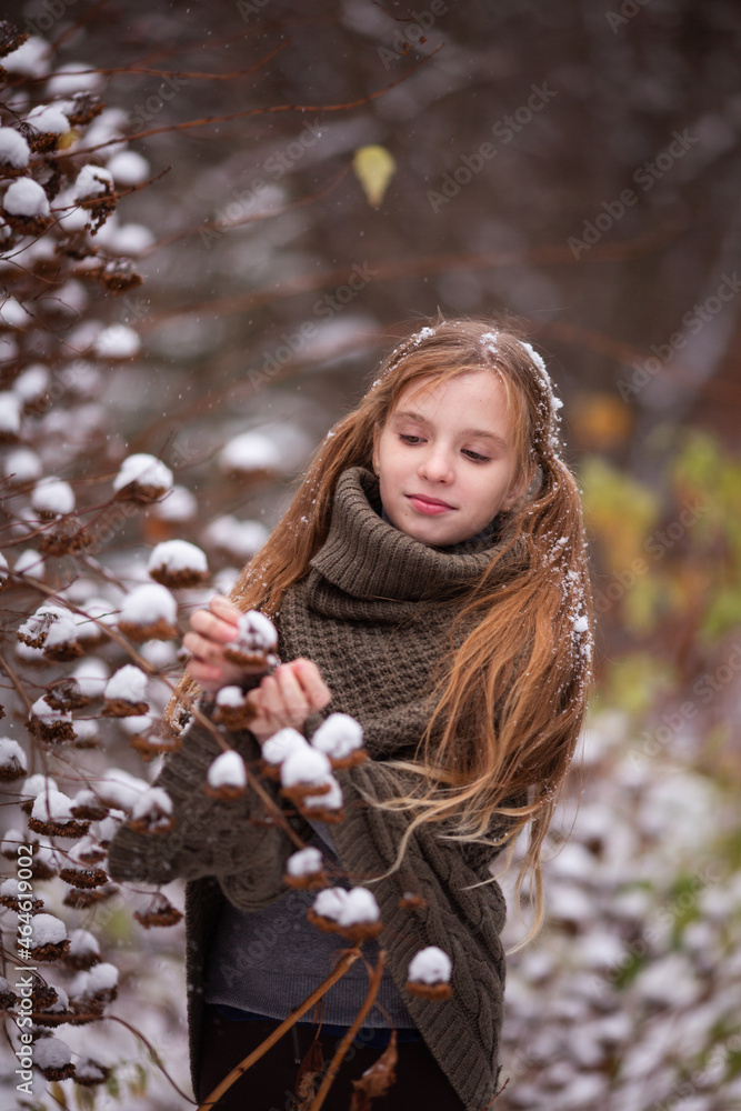 Fototapeta premium cute girl resting in nature on a winter day 
