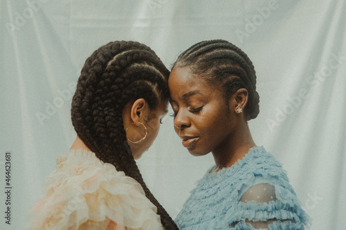 sisters together in cornrows photo