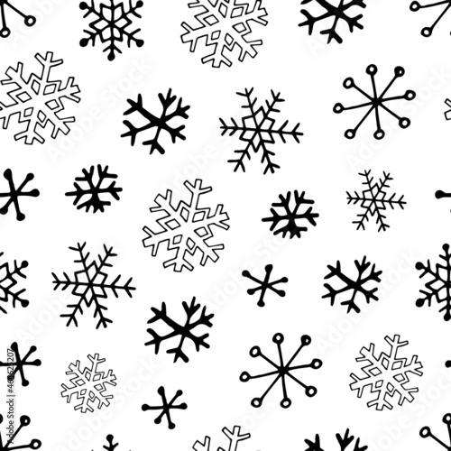 Vector seamless pattern from snowflakes. Hand-drawn illustrations in line art and doodle style. Creation of design for New Year  winter  Christmas
