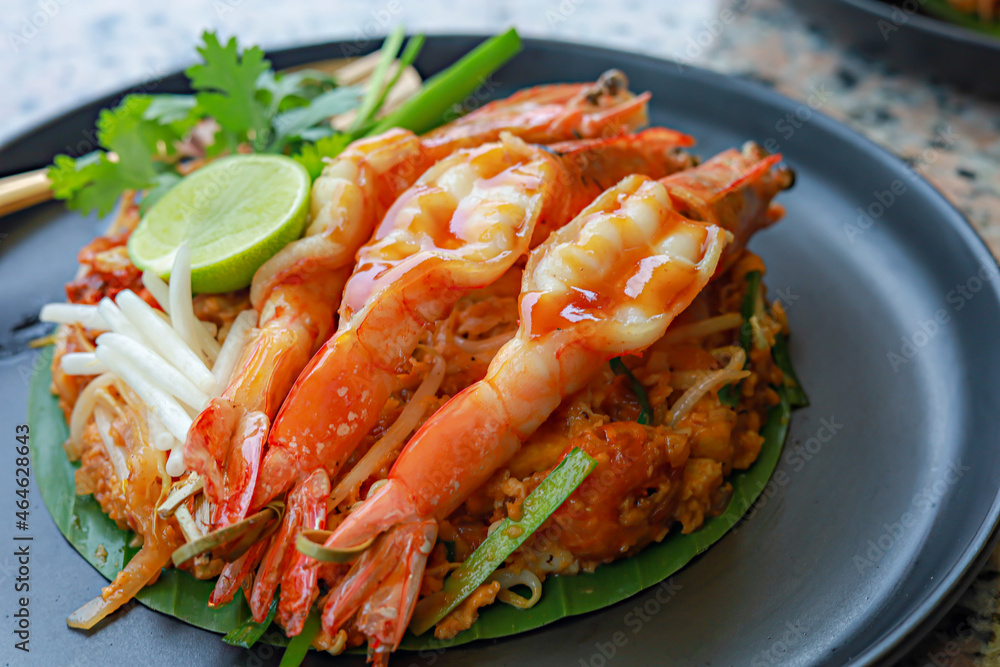 World famous freshly stir-fried cooked, Thai recipe of Prawn Pad Thai noodles World famous freshly stir-fried cooked, Thai recipe of Prawn Pad Thai noodles