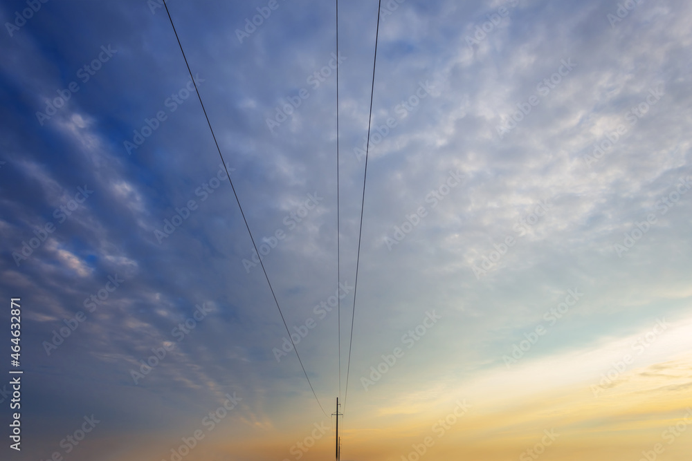 electric post and wire on dramatic sky background, concept industry background