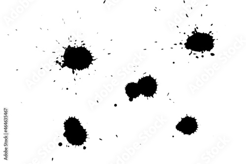Black blot on a white background. Spots of black ink on a piece of paper.