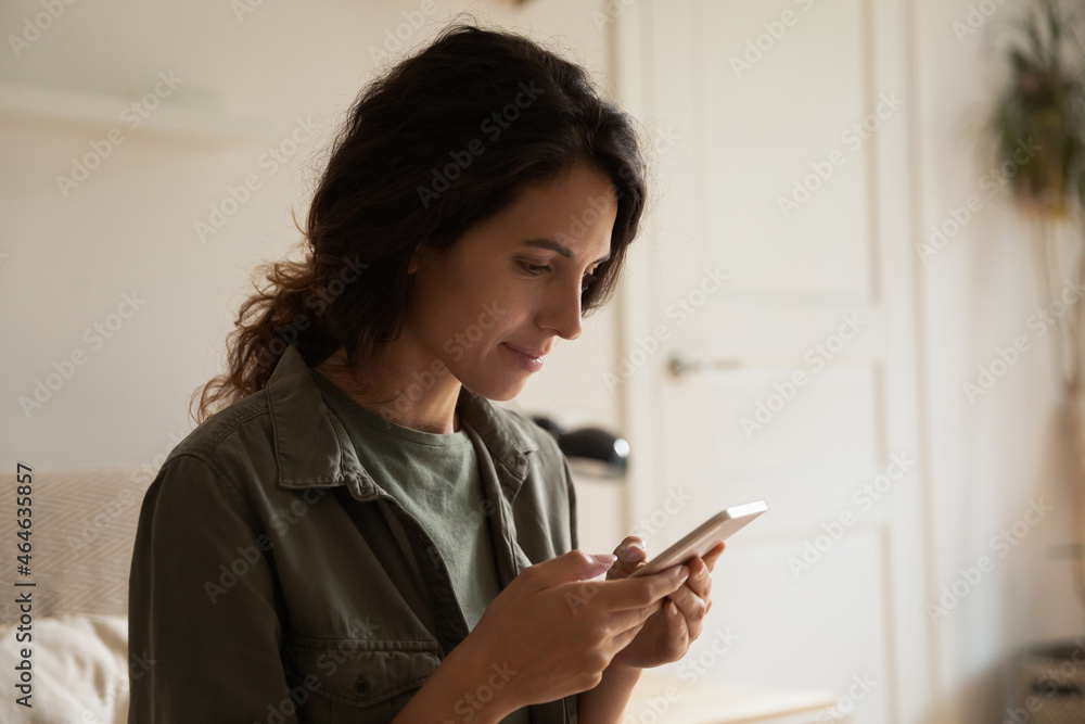 Focused positive cellphone user texting message, using app on smartphone, making call, chatting on social media websites, making virtual order, paying via internet bank service, shopping online Focused positive cellphone user texting message, using app on smartphone, making call, chatting on social media websites, making virtual order, paying via internet bank service, shopping online