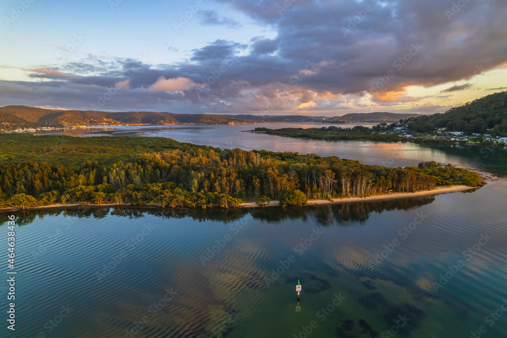 Aerial sunrise over the bay with clouds and reflections Aerial sunrise over the bay with clouds and reflections