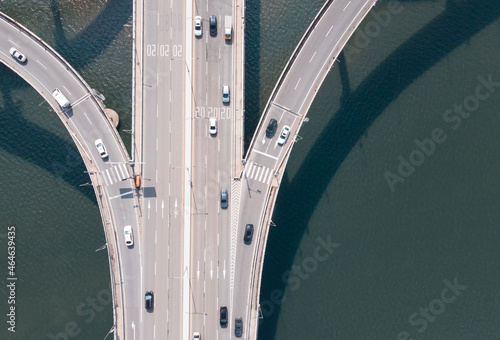 Photography Road junction and bridge on river in the city, aerial view.
