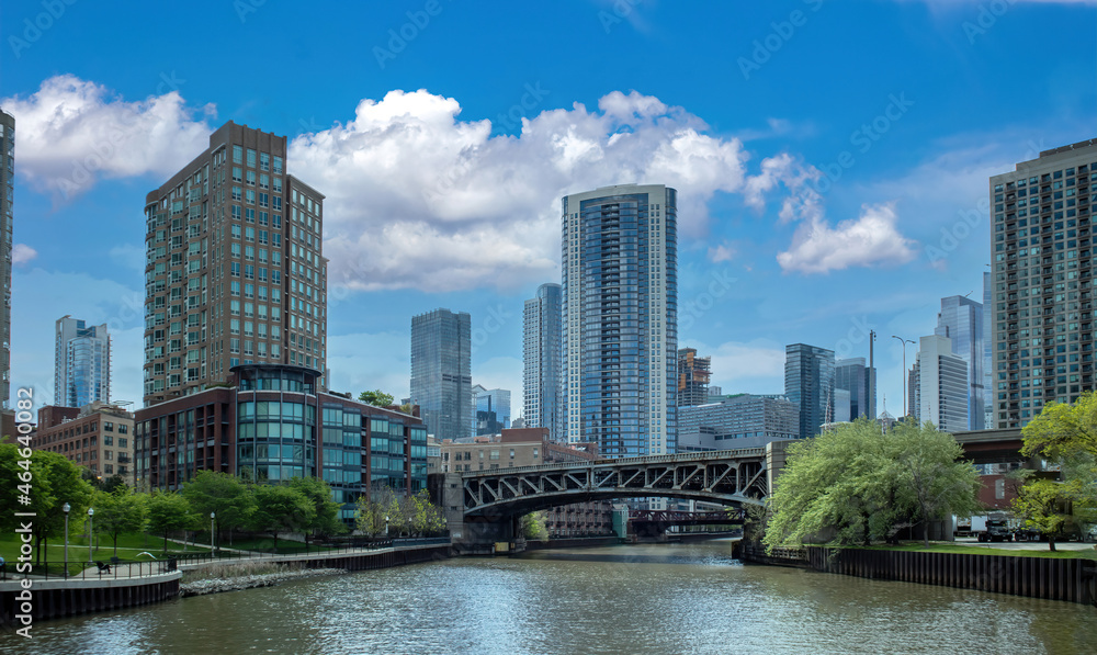 Chicago cityscape, waterfront skyscrapers on the river canal, spring day blue sky background. Illinois, USA