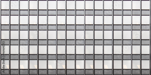 High rise glass building facade. Modern office skyscraper exterior curtain wall background.