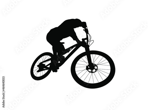 silhouette of a person riding a bike