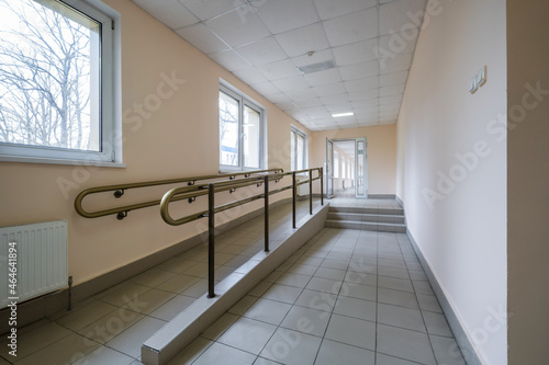 smooth rise and handrails inside the building for people with disabilities photo