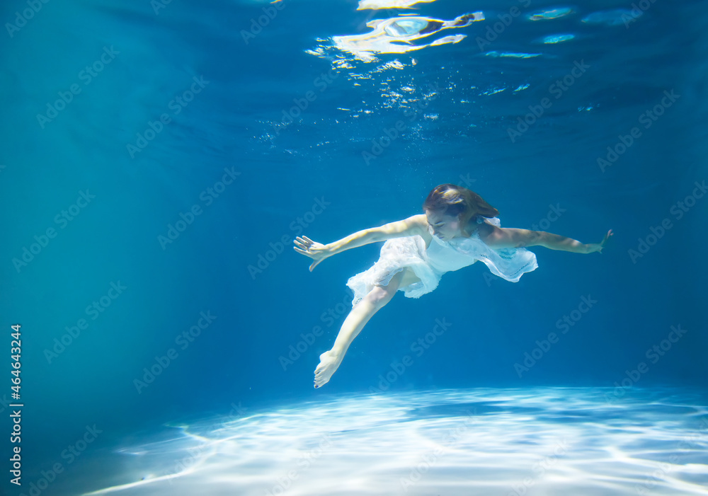 underwater shooting of a girl with loose hair