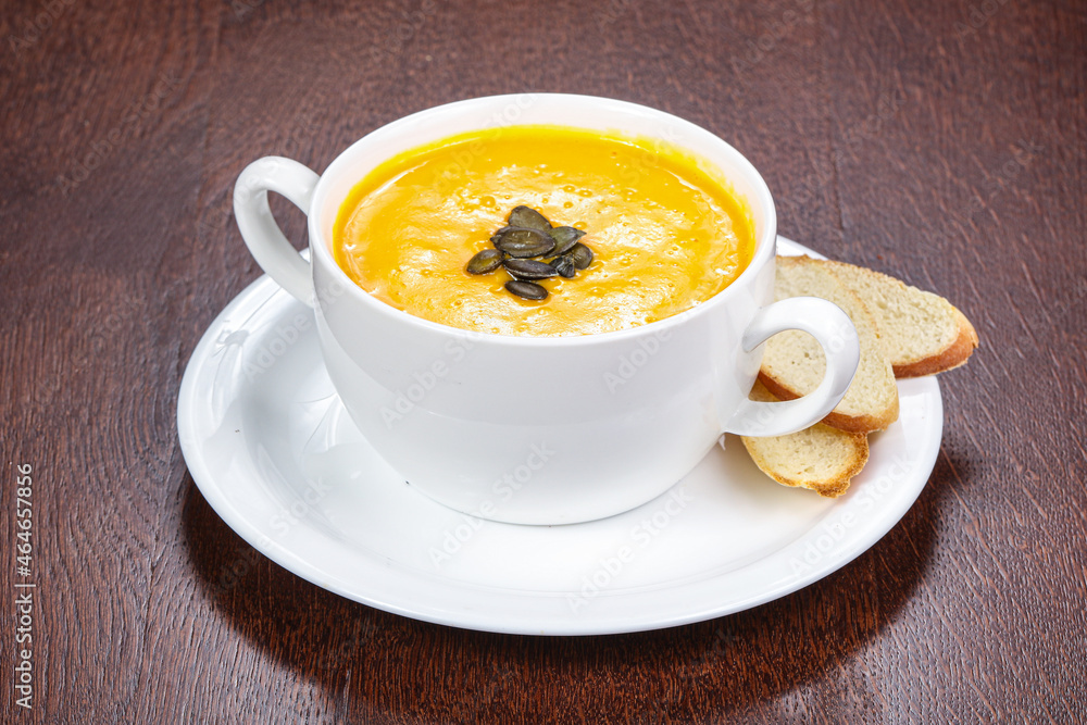 Tasty pumpkin soup with seeds Tasty pumpkin soup with seeds