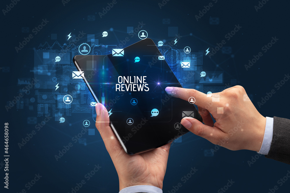 Businessman holding a foldable smartphone, social media concept Businessman holding a foldable smartphone, social media concept