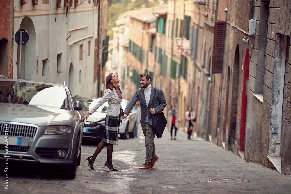 young business persons walking down the street