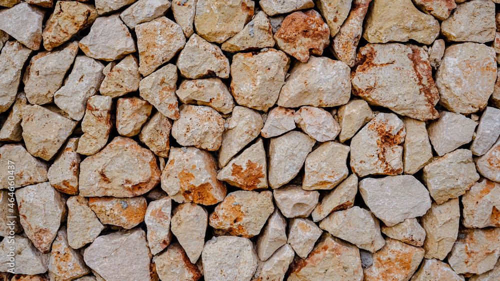 Fototapeta premium drywall texture. white and red interlocking stones. Menorca, Spain