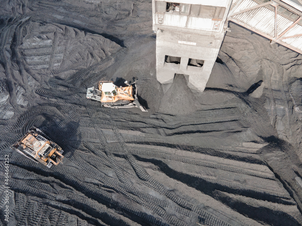 coal mining, top view aerial. Industrial zone. loading coal into trucks ...