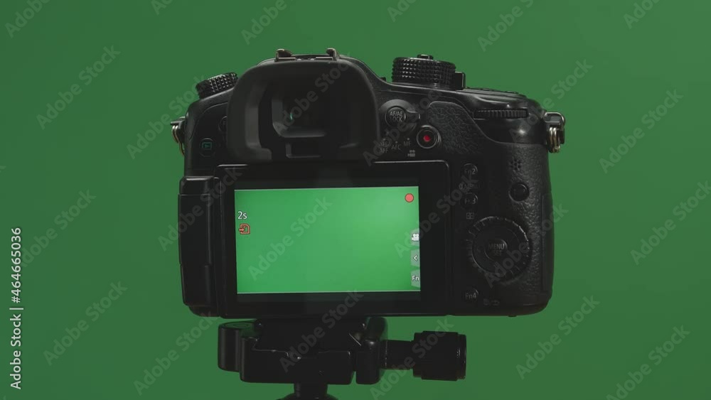 Male Hand Recording Video With Green Screen Display Camera In Green Background
Male Hand Recording Video With Green Screen Display Camera In Green Background