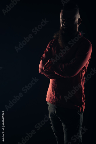 Silhouette of a beautiful strong nordic man with stylish hairstyle and beard on a isolated background. © qunica.com