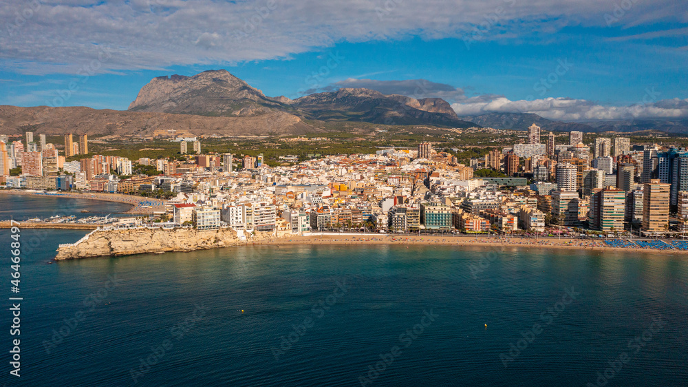 Benidorm,Alicante,Spain.Aerial photo from drone to Benidorm city skyline with beach and mountains in the background.These are the most beautiful views from the drone to the skyscrapers of Benidorm