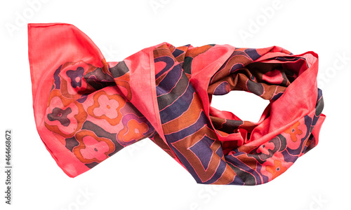 wrapped handcrafted red silk scarf hand-drawn with abstract pattern in cold contour technique isolated on white background