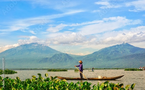 Fisherman in rawapening lake with mountain view background